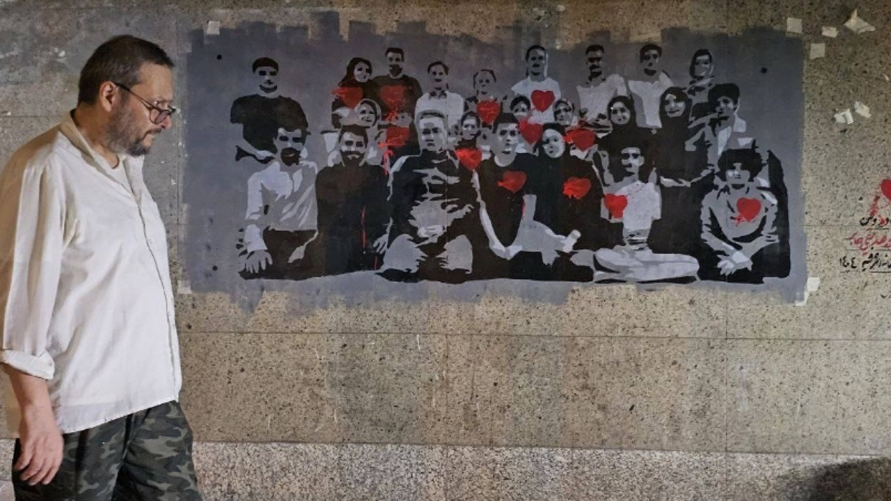 «نام جاوید وطن» به تصویر کشیده شد/ روایت نقاشی شهدا بر دیوار خیابانهای تهران
